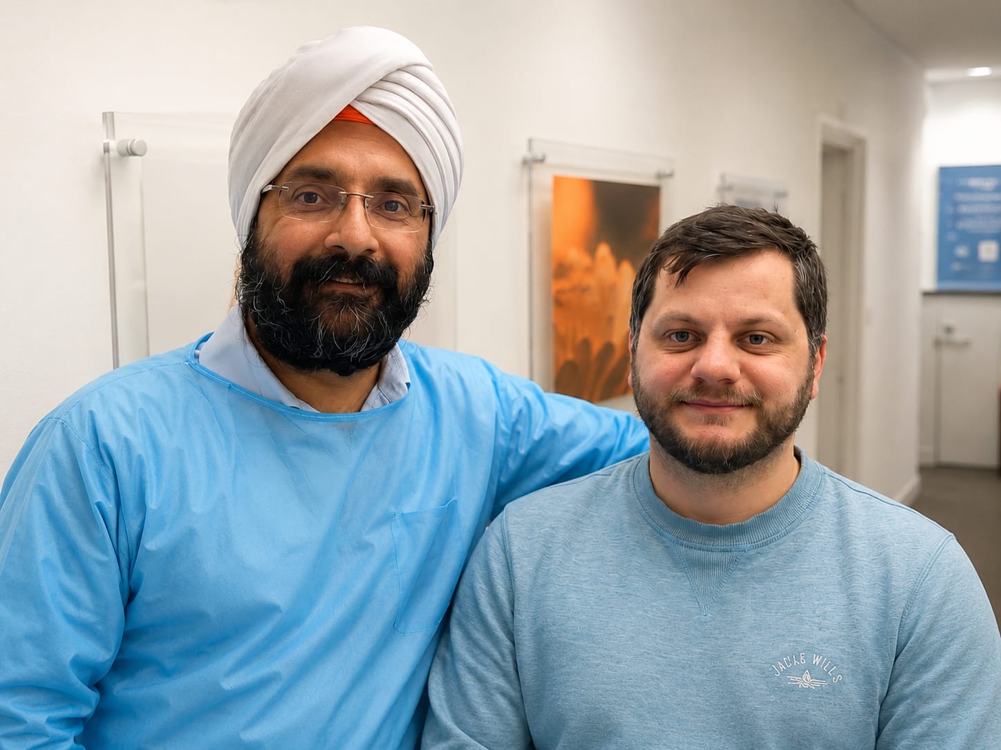 Alex Beasley with Dr Singh at Beautiful Dental Smiles after his implant treatment